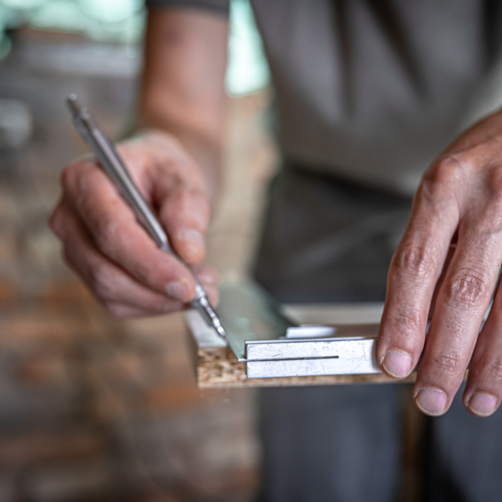 The Carpenter Marks The Piece Of Wood With A Pen And Ruler. The Carpenter Marks The Piece Of Wood With A Pen And Ruler.
