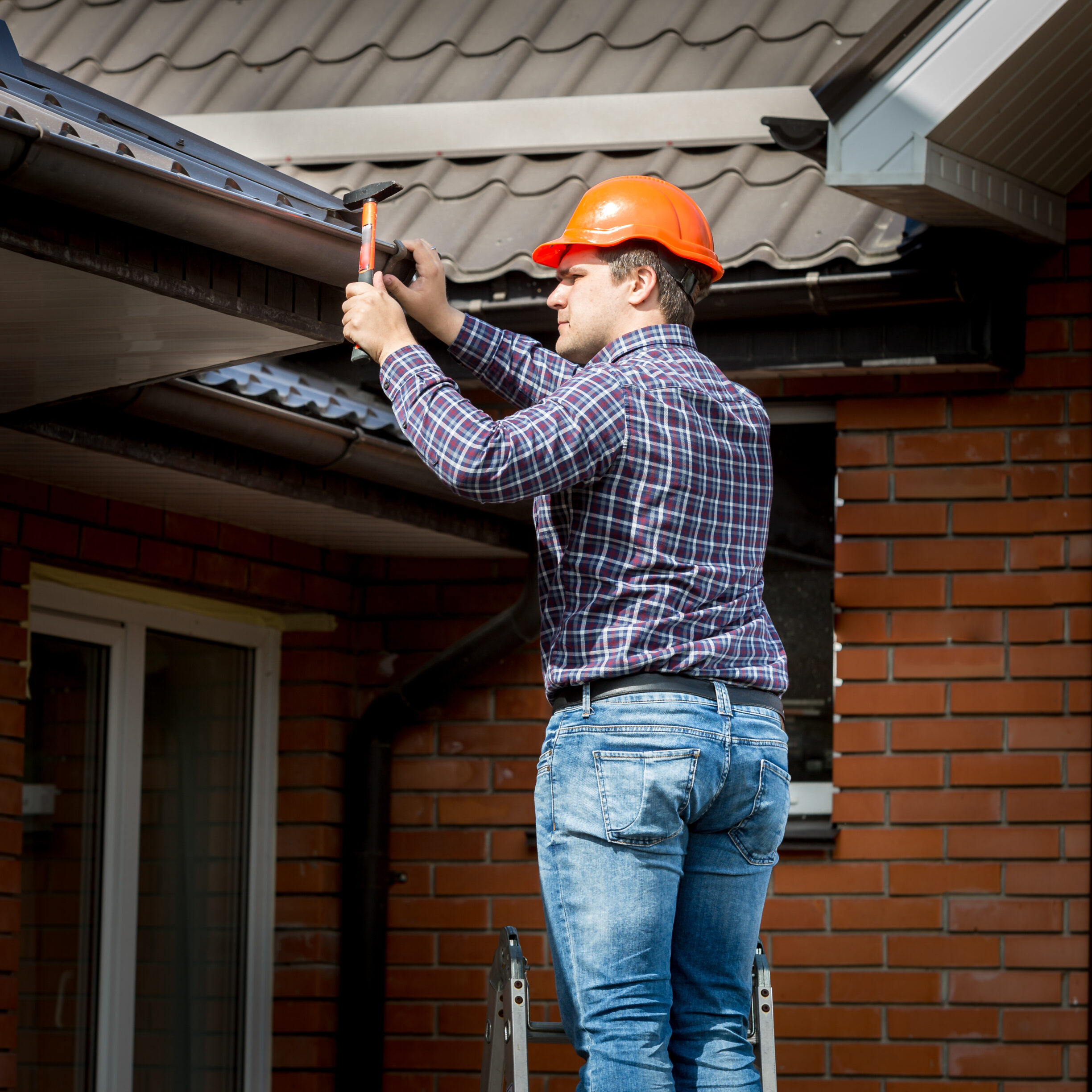 Carpenter Hammering Roof Boards With Hammer Carpenter Hammering Roof Boards With Hammer