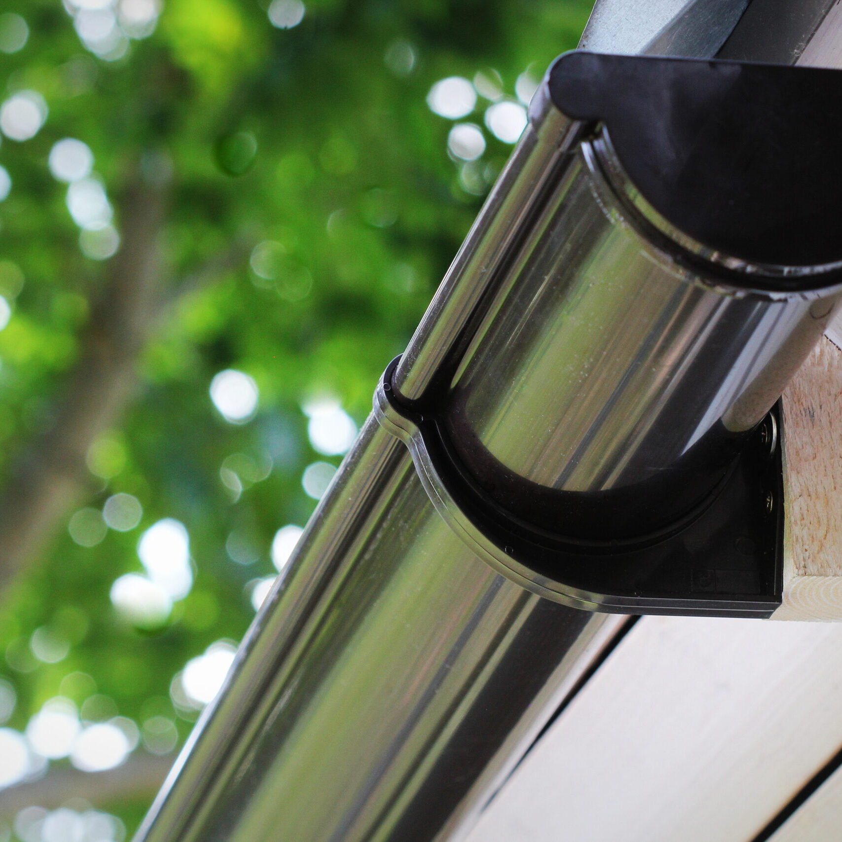 Rain Gutter Pipeline System Installation. Roofing Construction. Rain Gutter System And Roof Protection From Snow Rain Gutter Pipeline System Installation. Roofing Construction. Rain Gutter System And Roof Protection From Snow